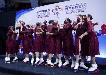 Haydenettes celebrate in kiss and cry after receiving free skate scores