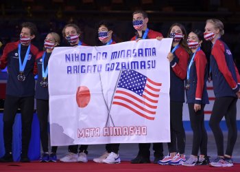 Team USA poses with "Thank you Japan" poster and silver medals at 2021 World Team Trophy