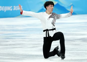 Vincent Zhou kneeling on the ice in his ending pose following his team event free skate at the Winter Olympic Games Beijing 2022.
