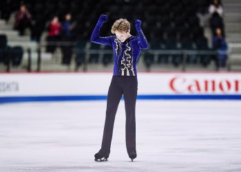 Ilia Malinin pumps his fists after a clean performance at the ISU World Junior Championships 2022.