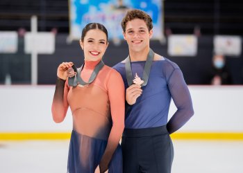 Caroline Green and Michael Parsons pose with bronze medals at Autumn Classic