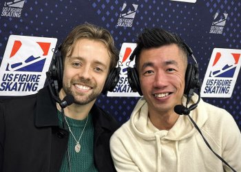 Wearing headsets in front of the U.S. Figure Skating banner, Jean-Luc Baker and Jackie Wong give expert analysis in Wichita.