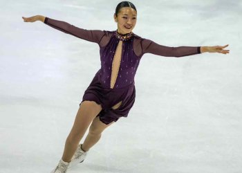 Julia Ran, arms extended to the side, performs for DC Edge