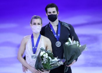 Madison Hubbell and Zachary Donohue pose with flowers and their silver medals at the World Championships in 2021.